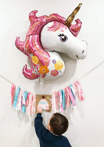 Two large helium-filled unicorn balloons, made of foil, measuring 44 inches each. They are party balloons and decorations for parties and events